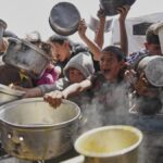 Aid groups report surge in looting amid threat of mass starvation in Gaza