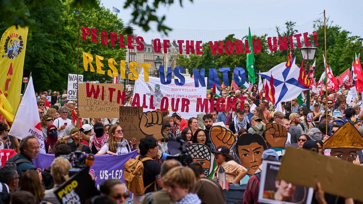 Hundreds take to the streets of the Hague in demonstration against NATO days before major summit