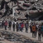 Officials say 85 Palestinians seeking aid are killed in Gaza as Israel widens evacuation orders