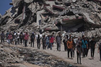 Officials say 85 Palestinians seeking aid are killed in Gaza as Israel widens evacuation orders