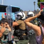 Riot police scuffle with demonstrators on Rhodes during visit by Israeli cruise ship