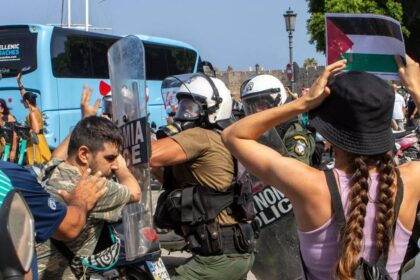 Riot police scuffle with demonstrators on Rhodes during visit by Israeli cruise ship