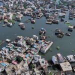 At least four killed and several trapped in flash flooding in northern India, officials say
