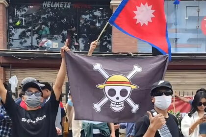 Asian youths fly ‘One Piece’ flag in protest