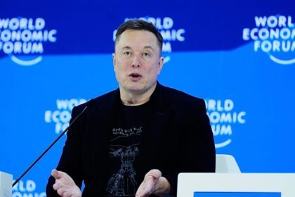Elon Musk predicts robot-majority future in first Davos appearance